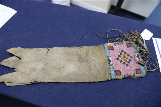 A Native American buckskin and beadwork gauntlet, Northern Plains, 19th century, Approx 45cm